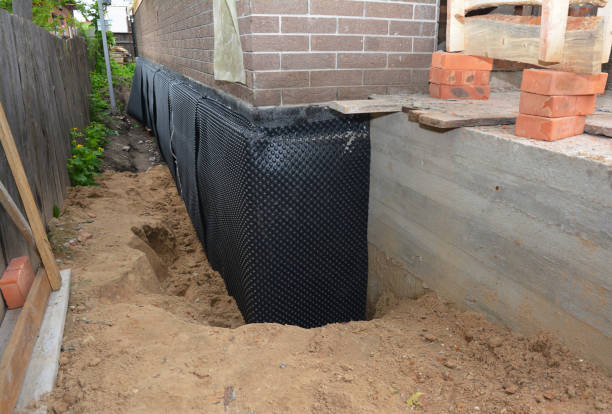 SJ Waterproofing Pros technician performing targeted Waterproofing assessment in Vermontville, MI